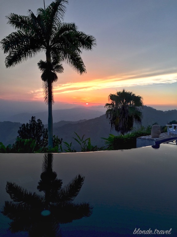 The infinity pool reflecting the evening sky