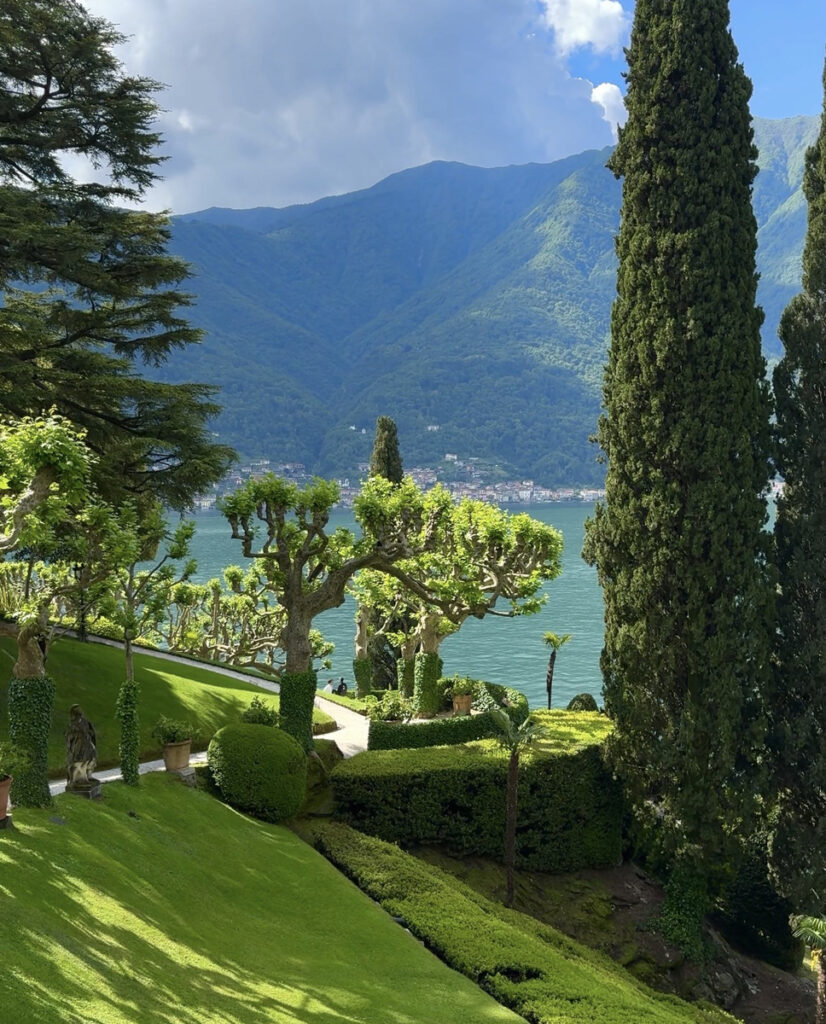 Terraced gardens, clipped trees, and tall cypresses descend toward Lake Como at Villa del Balbianello.