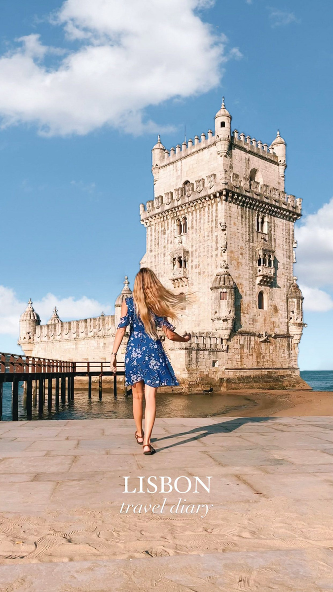 Olga visiting Belém Tower beside the Tagus in Lisbon.