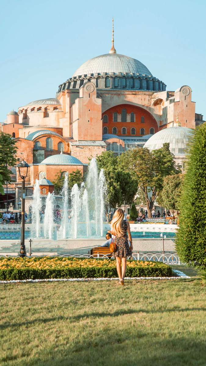 Olga looking towards Hagia Sophia across its gardens and fountains in Istanbul.