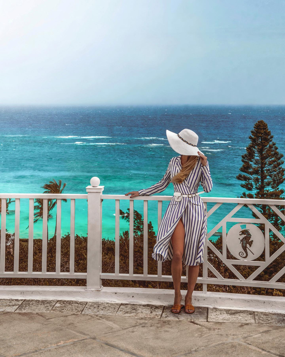 Olga overlooking brilliant turquoise Atlantic water from a Bermuda terrace.
