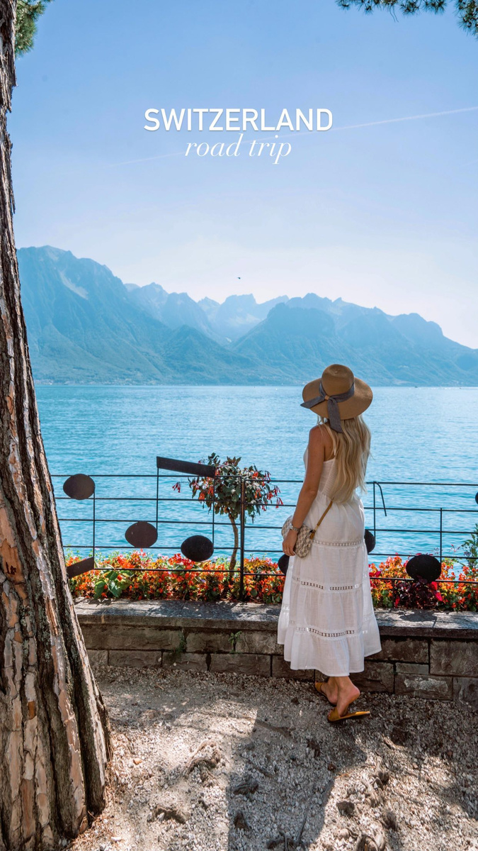 Olga overlooking a Swiss lake and mountains in the Bernese Oberland.