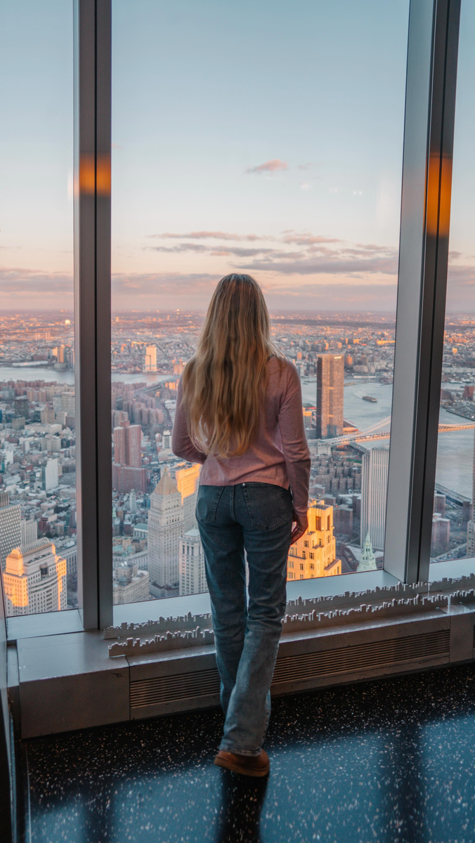 Olga looking across Manhattan from the windows of One World Observatory.