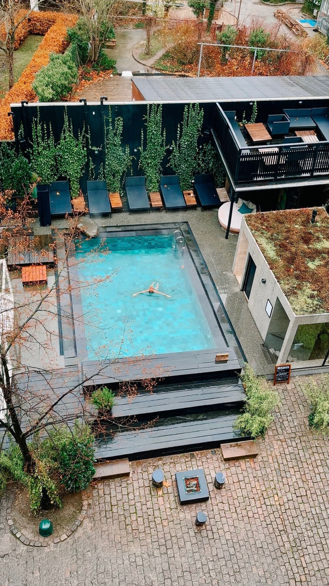 A rooftop pool overlooking a quiet Copenhagen courtyard.