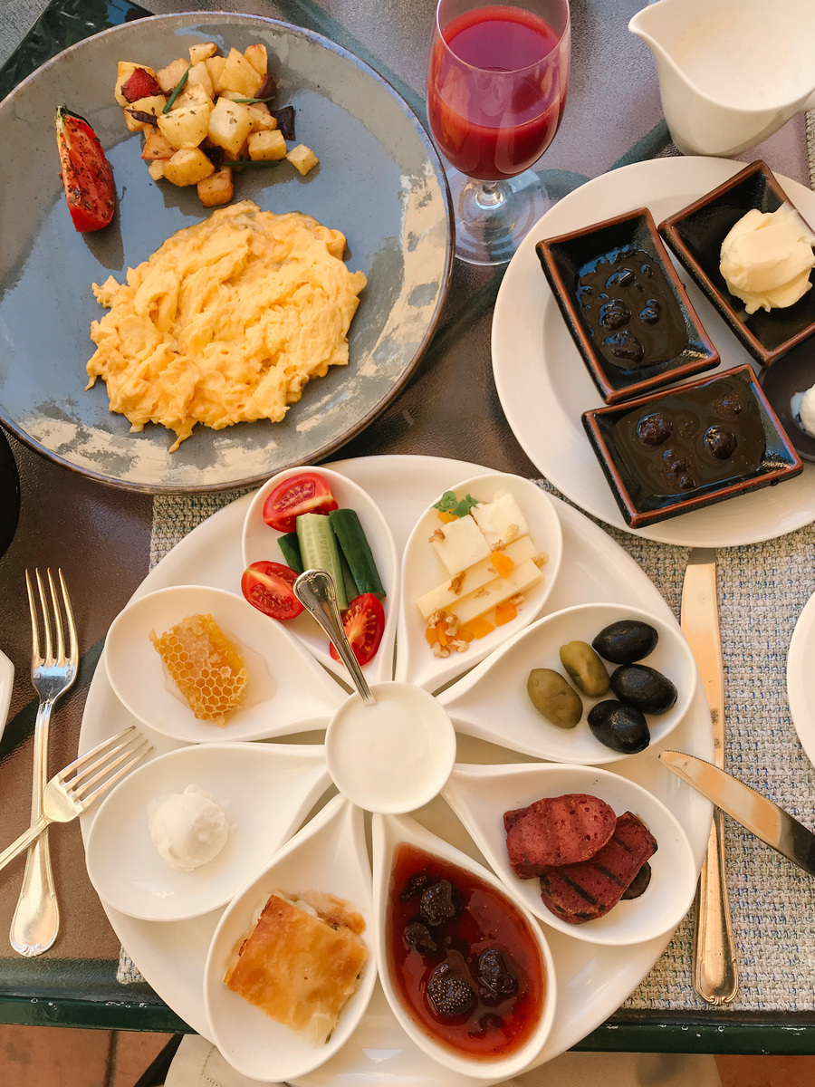 A Turkish breakfast at Four Seasons Sultanahmet with eggs, cheese, honeycomb, olives, vegetables, börek and preserves.