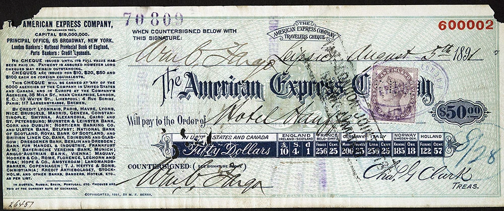 An 1891 American Express fifty-dollar Travelers Cheque with two matching Wm. C. Fargo signatures, a Leipzig date and a table of exchange values.