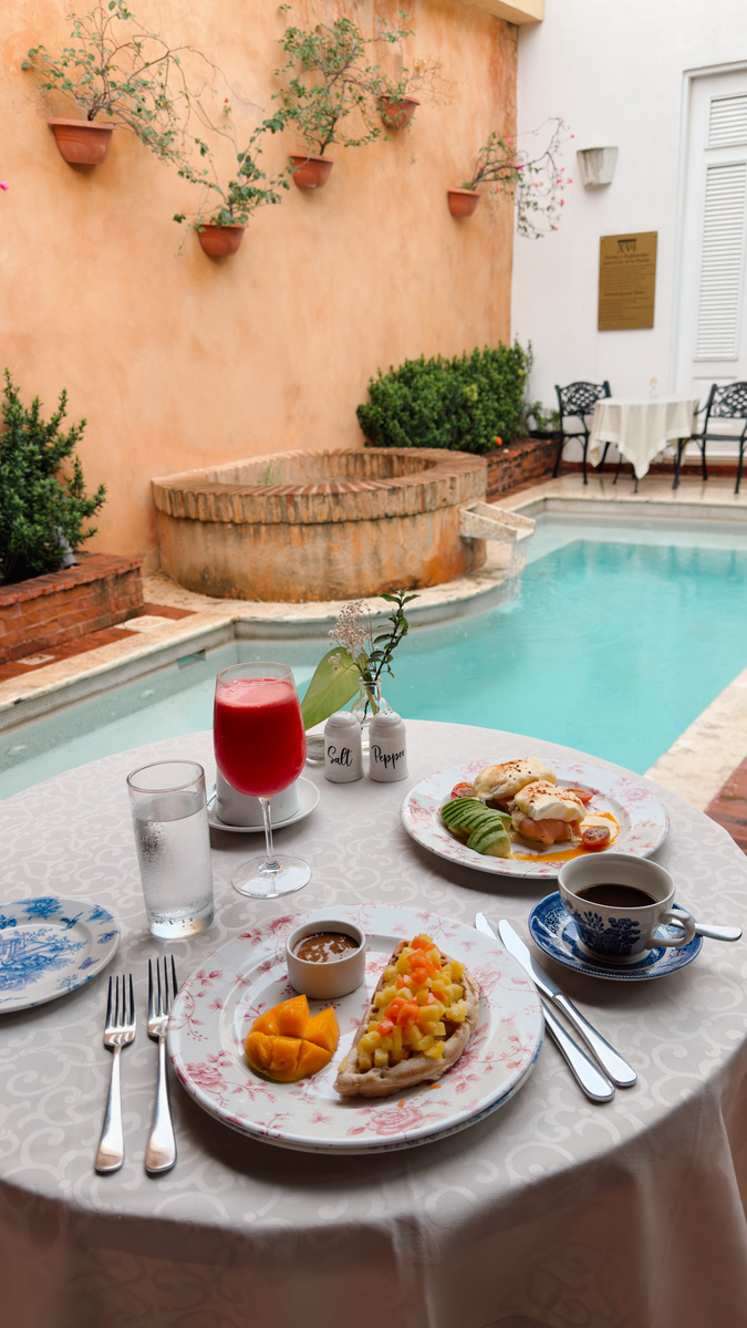 Breakfast is set beside the plunge pool built around an ancient well in the courtyard of Casa del Pozo at Casas del XVI.