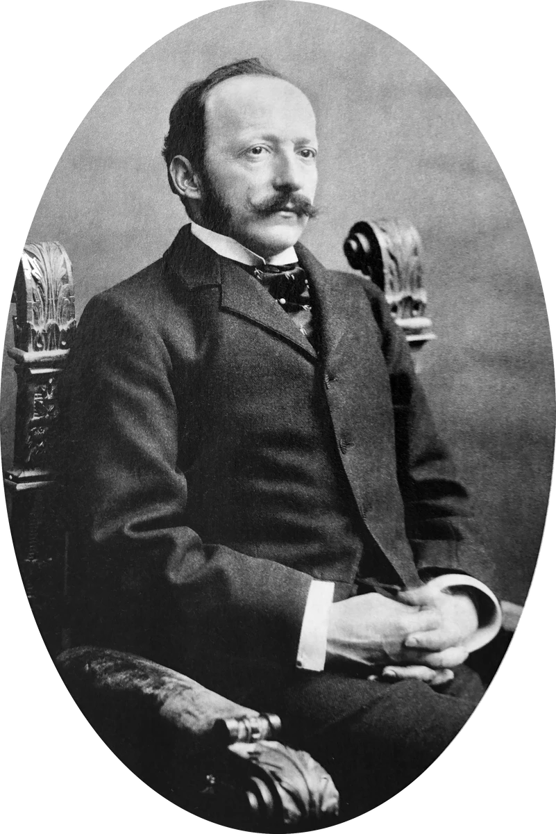 Black-and-white oval portrait of César Ritz in a dark jacket, high collar and tie, with a curled moustache.