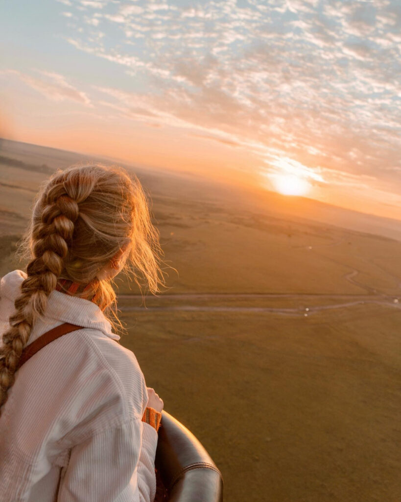 Olga watching sunrise from a hot-air balloon above the Masai Mara on her birthday.