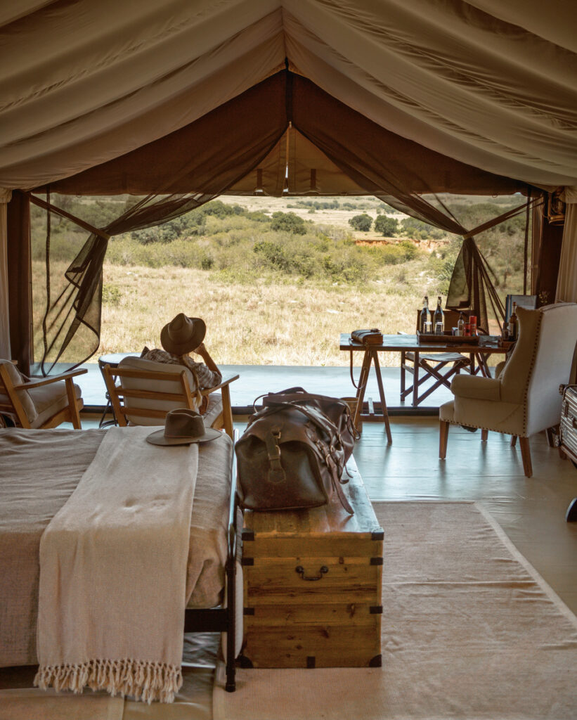 My husband looking across the Masai Mara from inside our canvas tent at Entim Camp.
