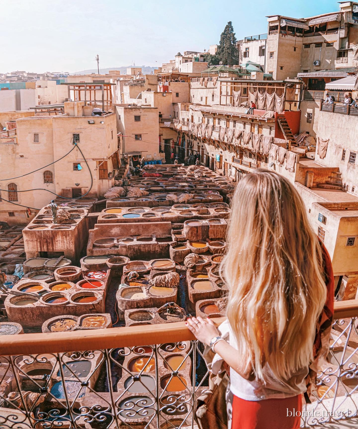 Olga looks over the stone dye vats at Chouara Tannery in Fez.