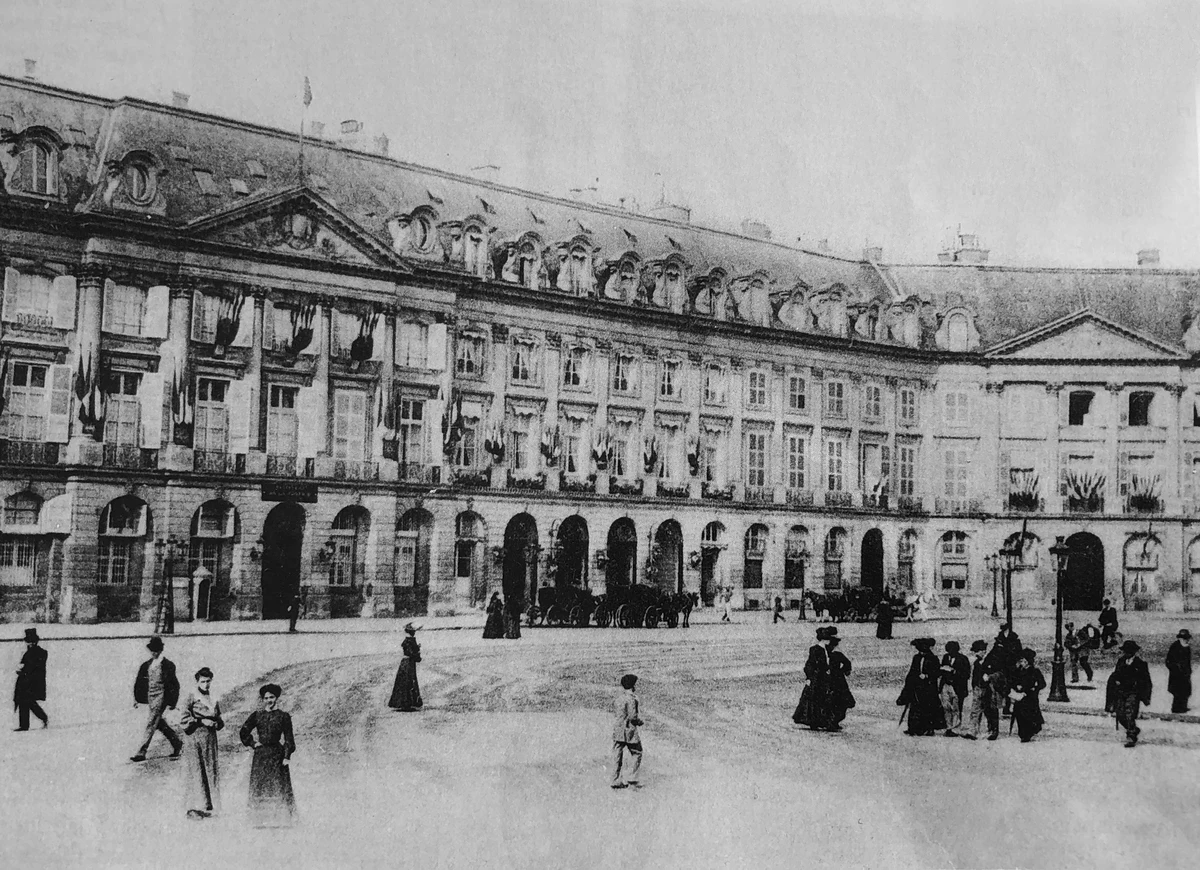 Black-and-white photograph of the Hôtel Ritz Paris façade and entrance on Place Vendôme around 1900.