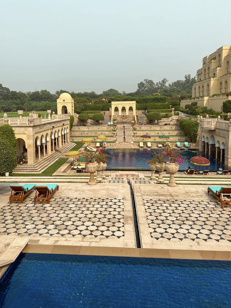 The swimming pool and terraced gardens at The Oberoi Amarvilas, seen from above.