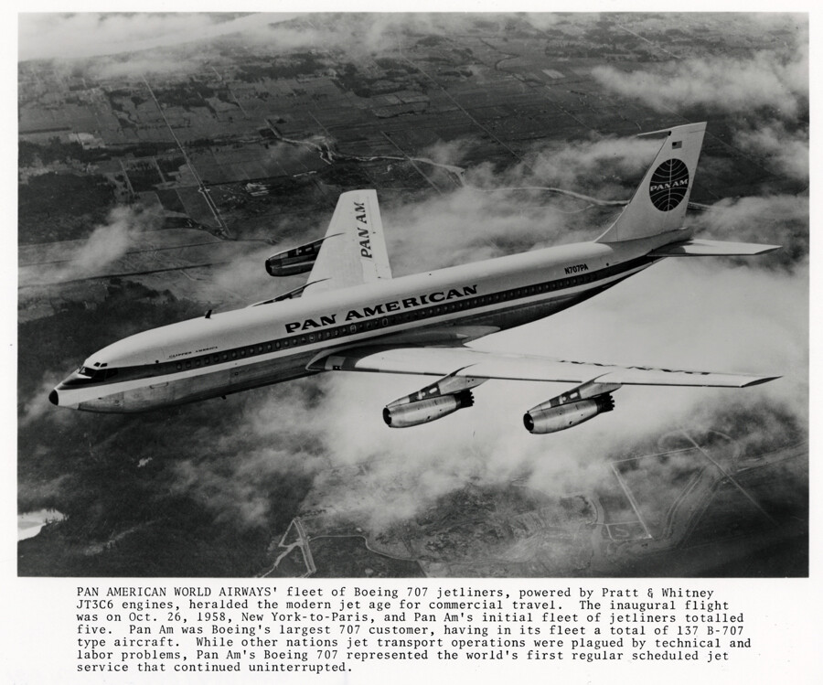 A Pan American Boeing 707 jetliner flying above clouds in a black-and-white promotional photograph.