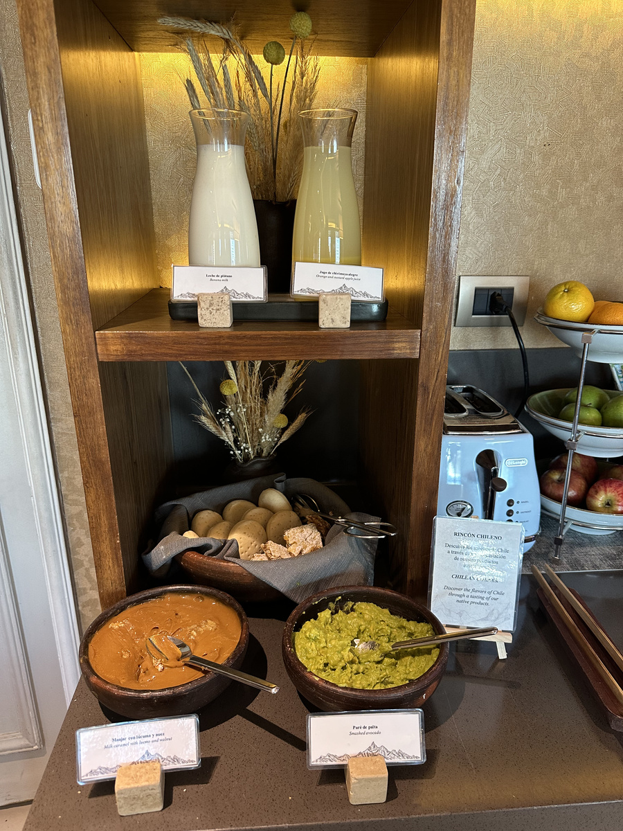 A Chilean breakfast corner in The Ritz-Carlton Santiago Club Lounge displays banana milk, chirimoya alegre juice, pan amasado, manjar with lúcuma and walnut, and smashed avocado.