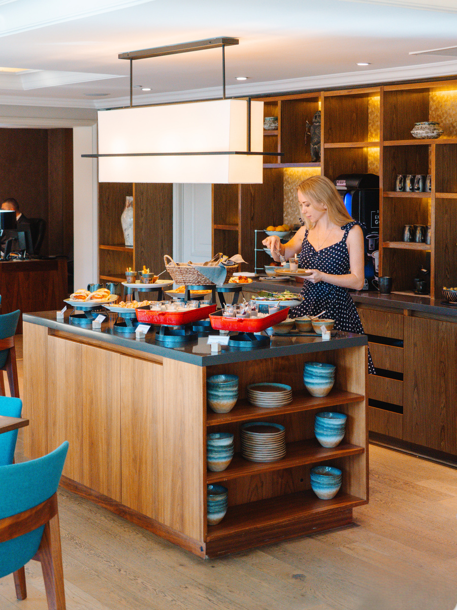 Olga stands beside the buffet in The Ritz-Carlton Santiago Club Lounge.