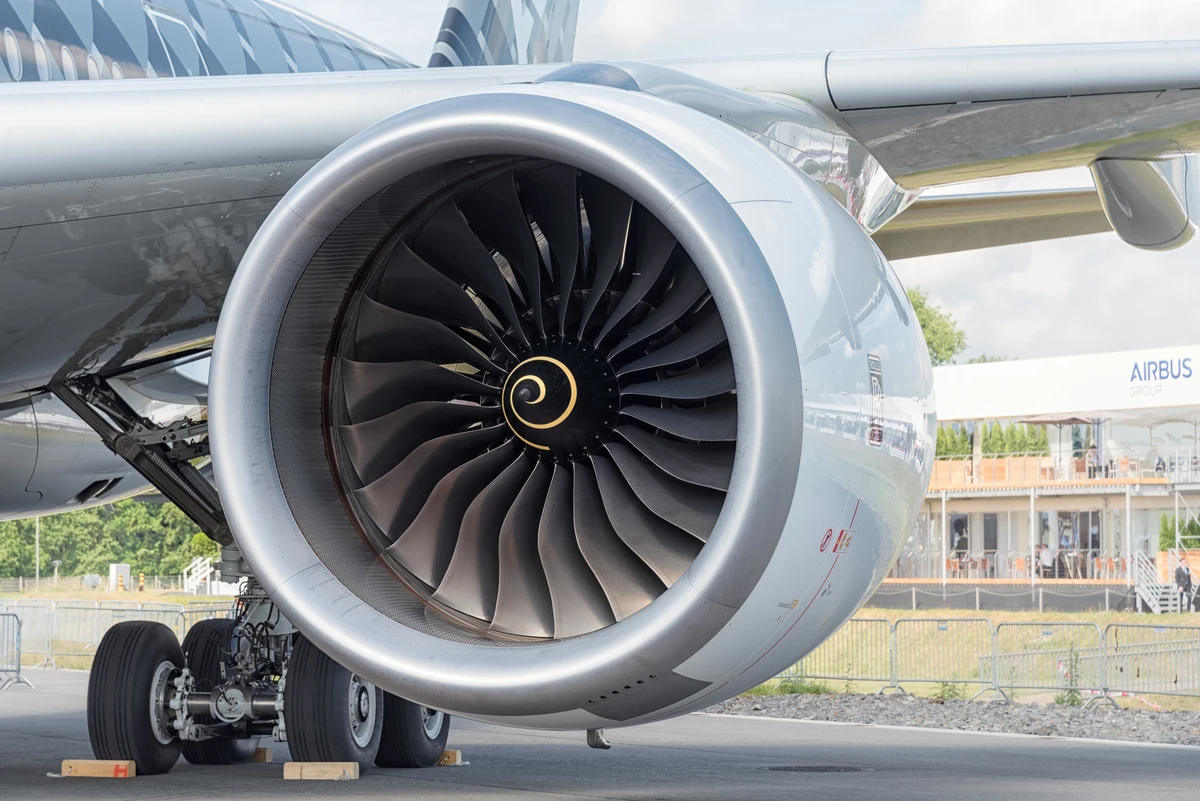 Front view of a Rolls-Royce Trent XWB turbofan beneath the wing of an Airbus A350.