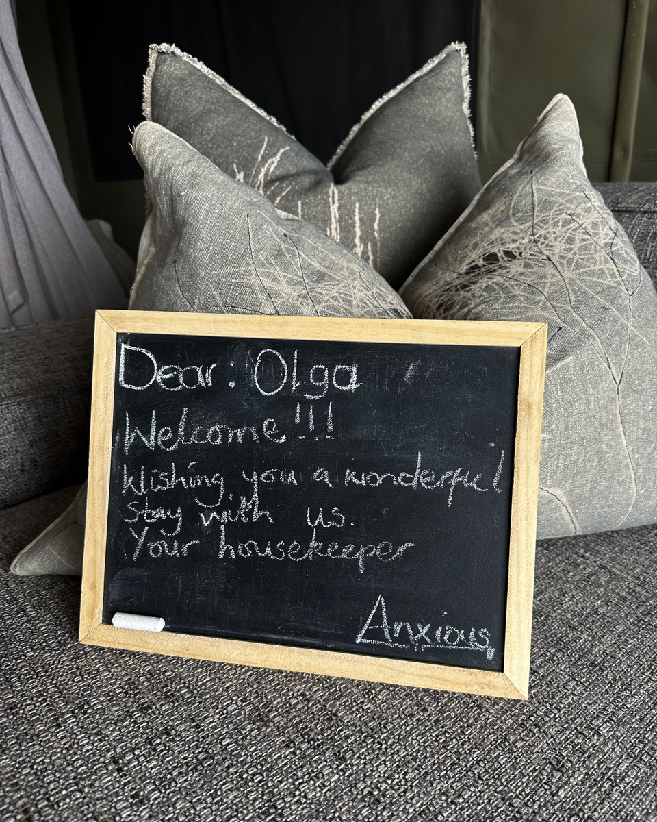A handwritten chalkboard in Olga’s tented suite welcomes her to Victoria Falls River Lodge.