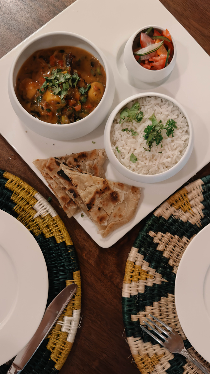 Coconut octopus curry is served with rice and chapati after the cooking class at Zanzibar White Sand.