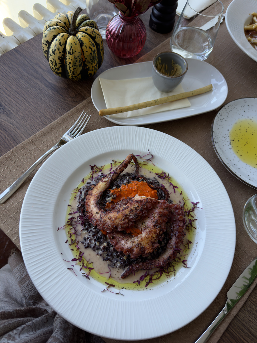 Grilled octopus with black rice at Old Cellar Bled.