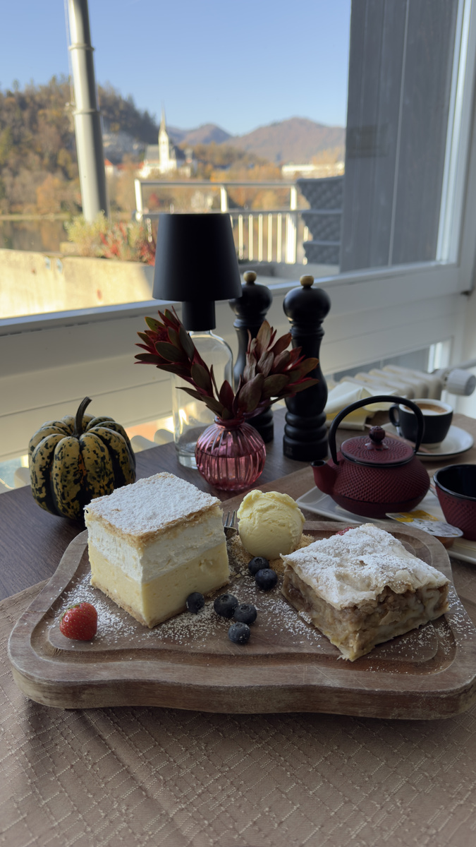 Bled cream cake and apple strudel beside the lake-facing window at Old Cellar Bled.