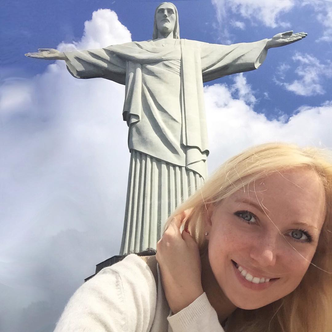 Olga beneath Christ the Redeemer on Corcovado in Rio de Janeiro.