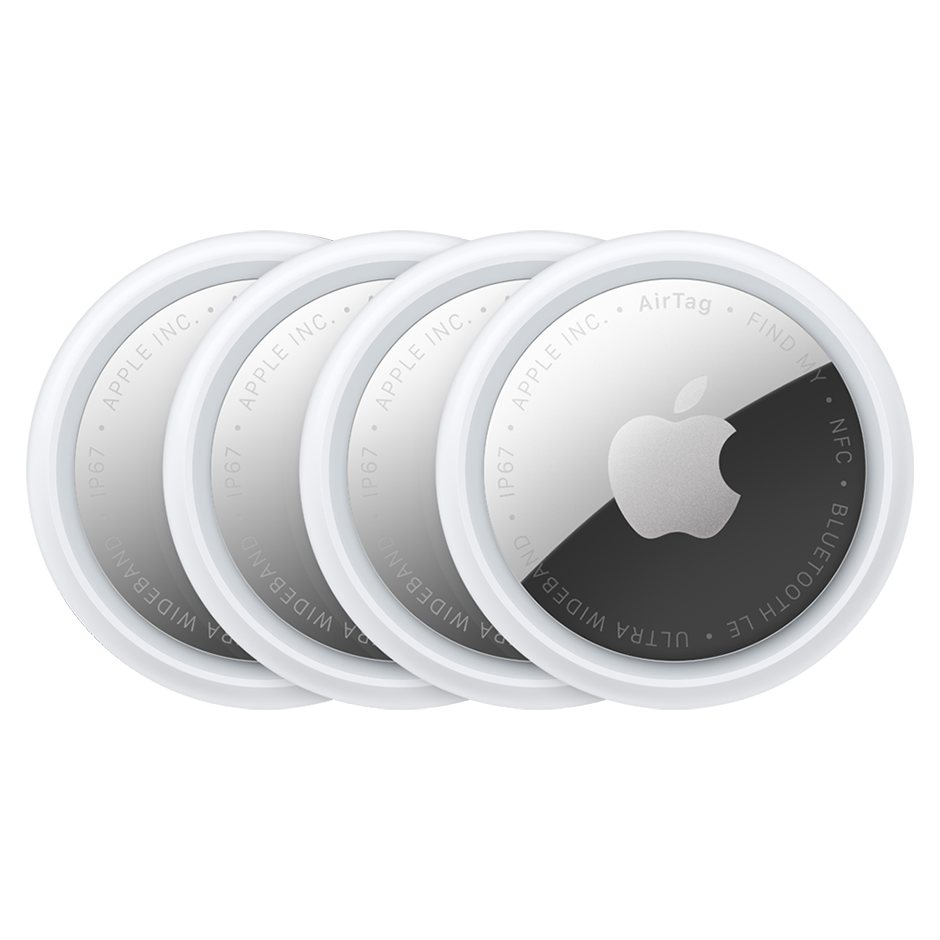 Four overlapping silver-and-white Apple AirTags.