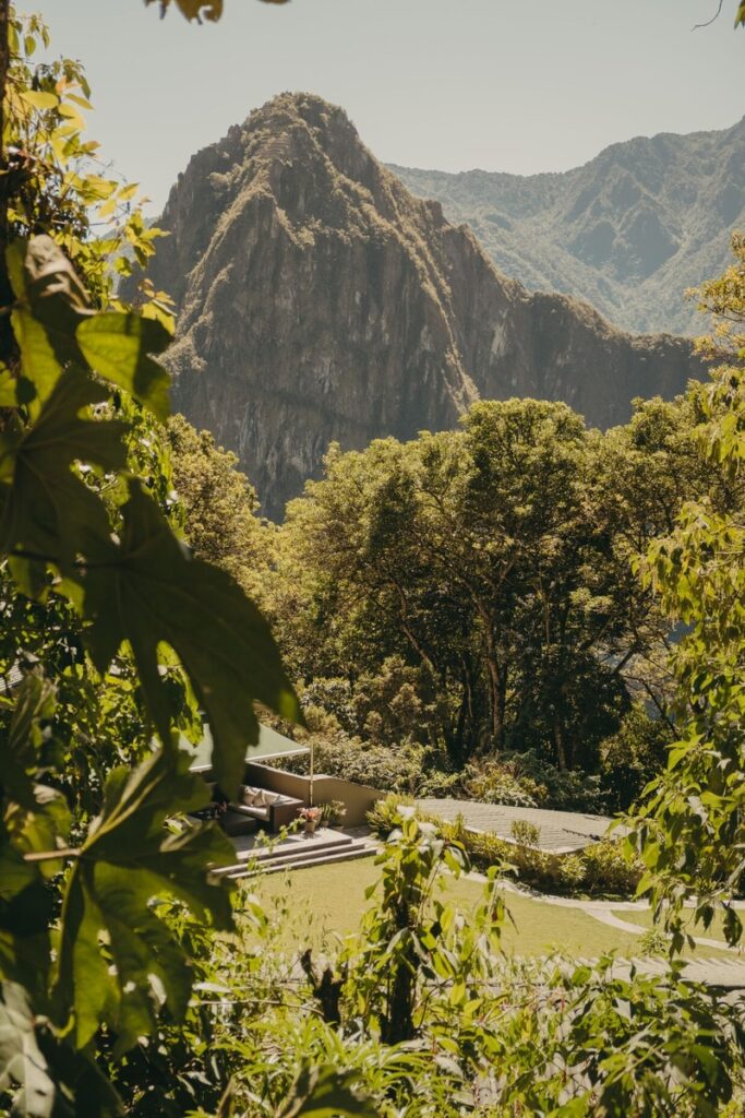 Huayna Picchu rises beyond the trees and garden terraces below Sanctuary Lodge’s viewing platform.