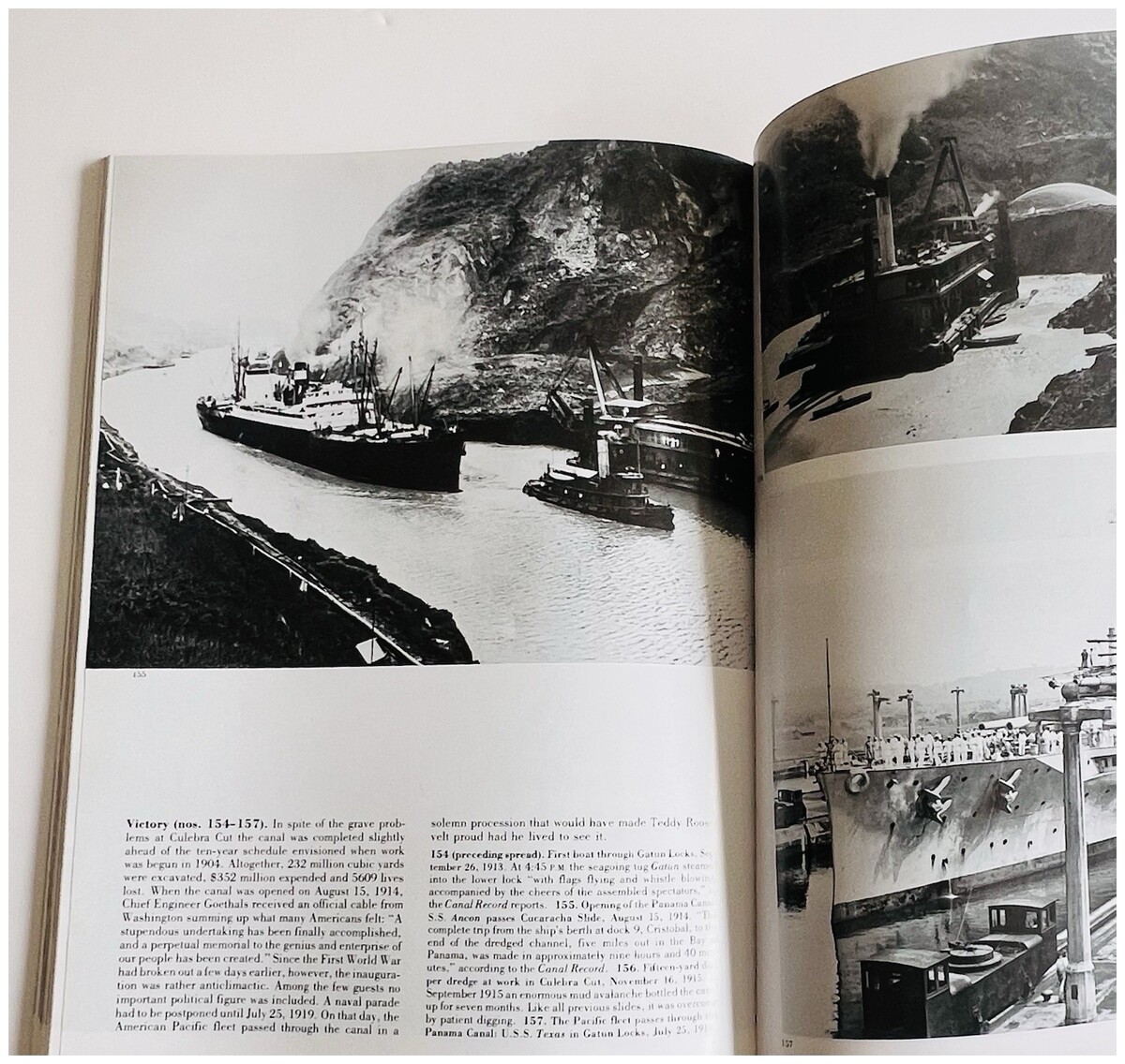 An open spread showing the S.S. Ancon passing Cucaracha Slide on the Canal’s opening day, beside photographs of a dredge and the battleship Texas in a lock.