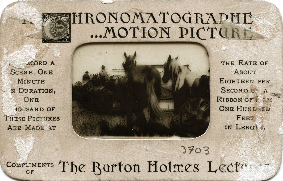 A worn souvenir card titled Chronomatographe Motion Pictures, framing a single film frame of horses and riders.