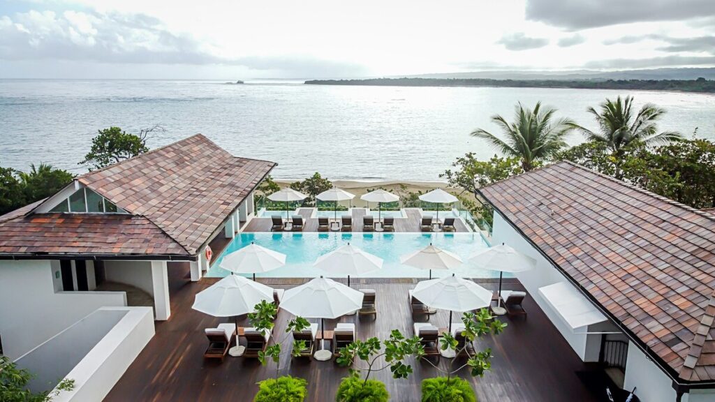 Aerial view of Casa Colonial’s rooftop pool and terraces overlooking Playa Dorada and the Atlantic