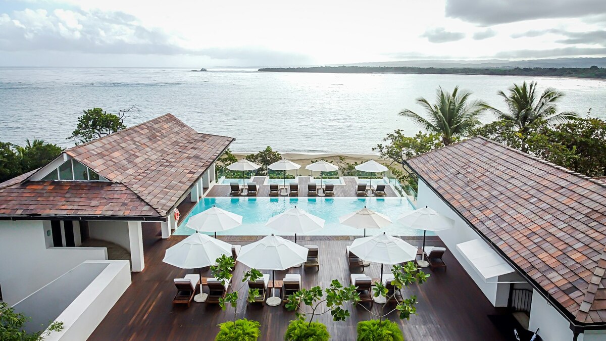 Aerial view of Casa Colonial’s rooftop pool and terraces overlooking Playa Dorada and the Atlantic