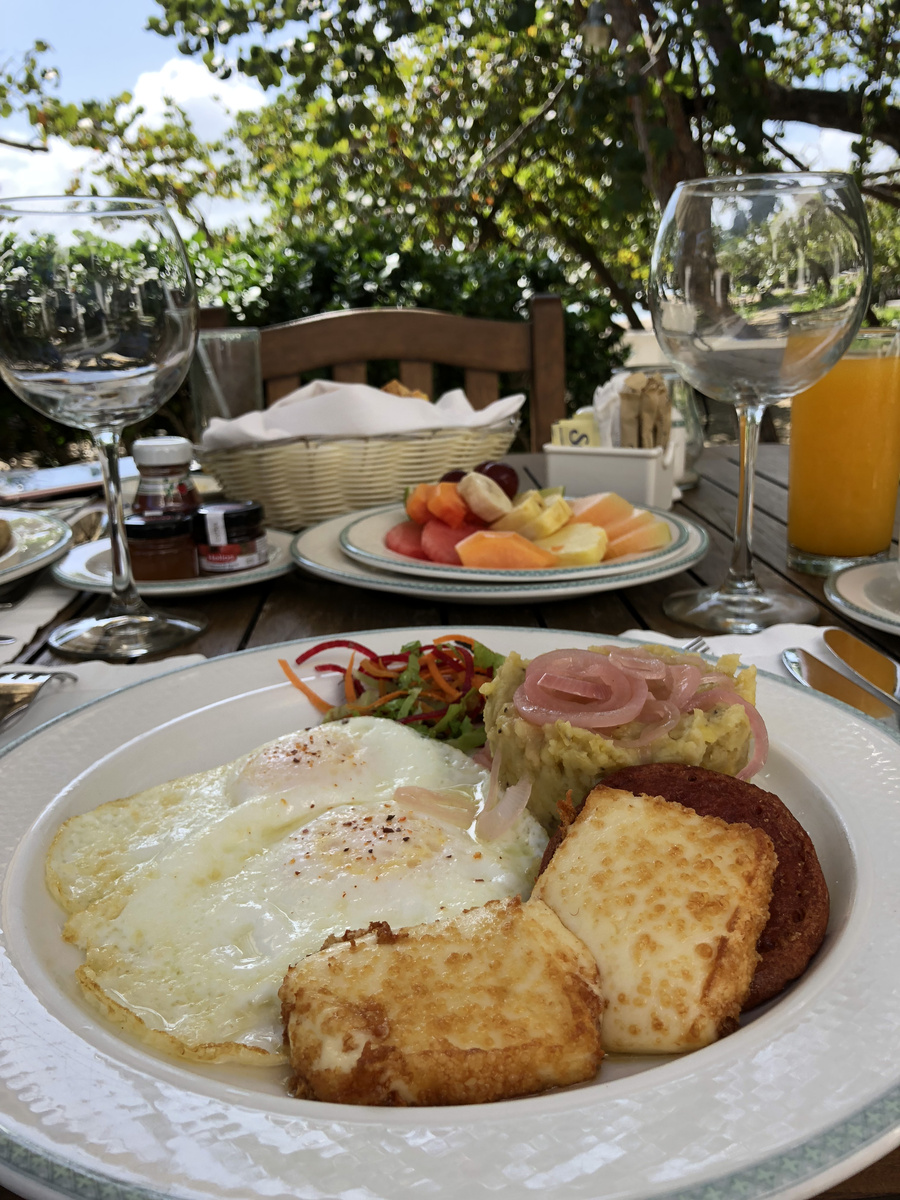 Eggs and fruit with juice at breakfast on the terrace