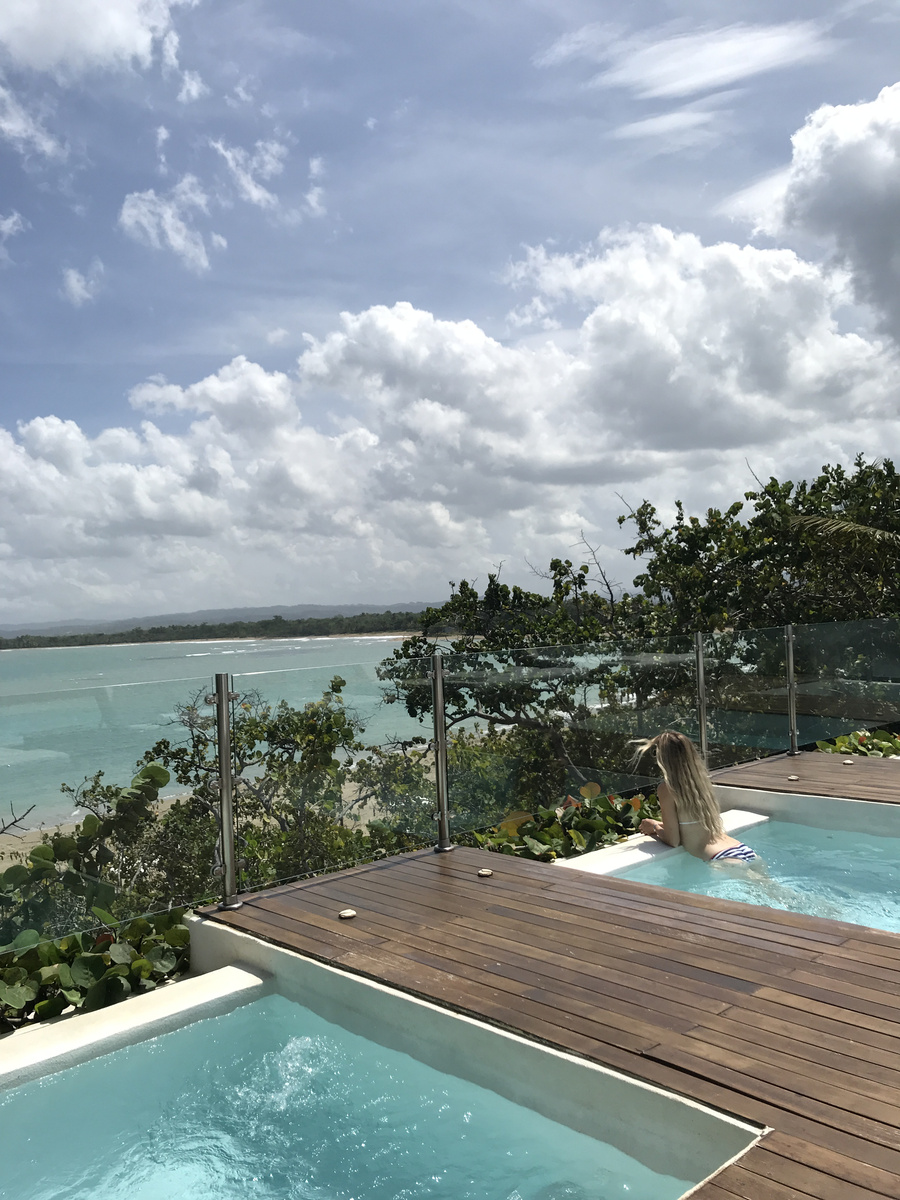 Olga in a rooftop hot tub overlooking Playa Dorada