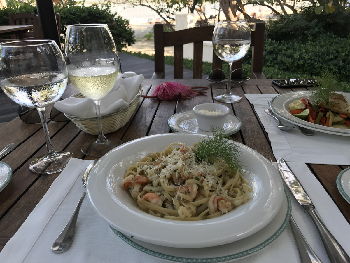 Pasta and a second main course served on the terrace