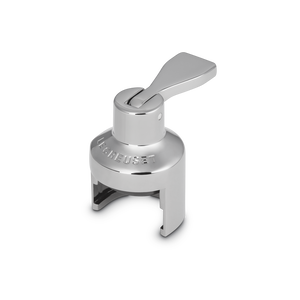 Silver Le Creuset champagne stopper with its lever raised.