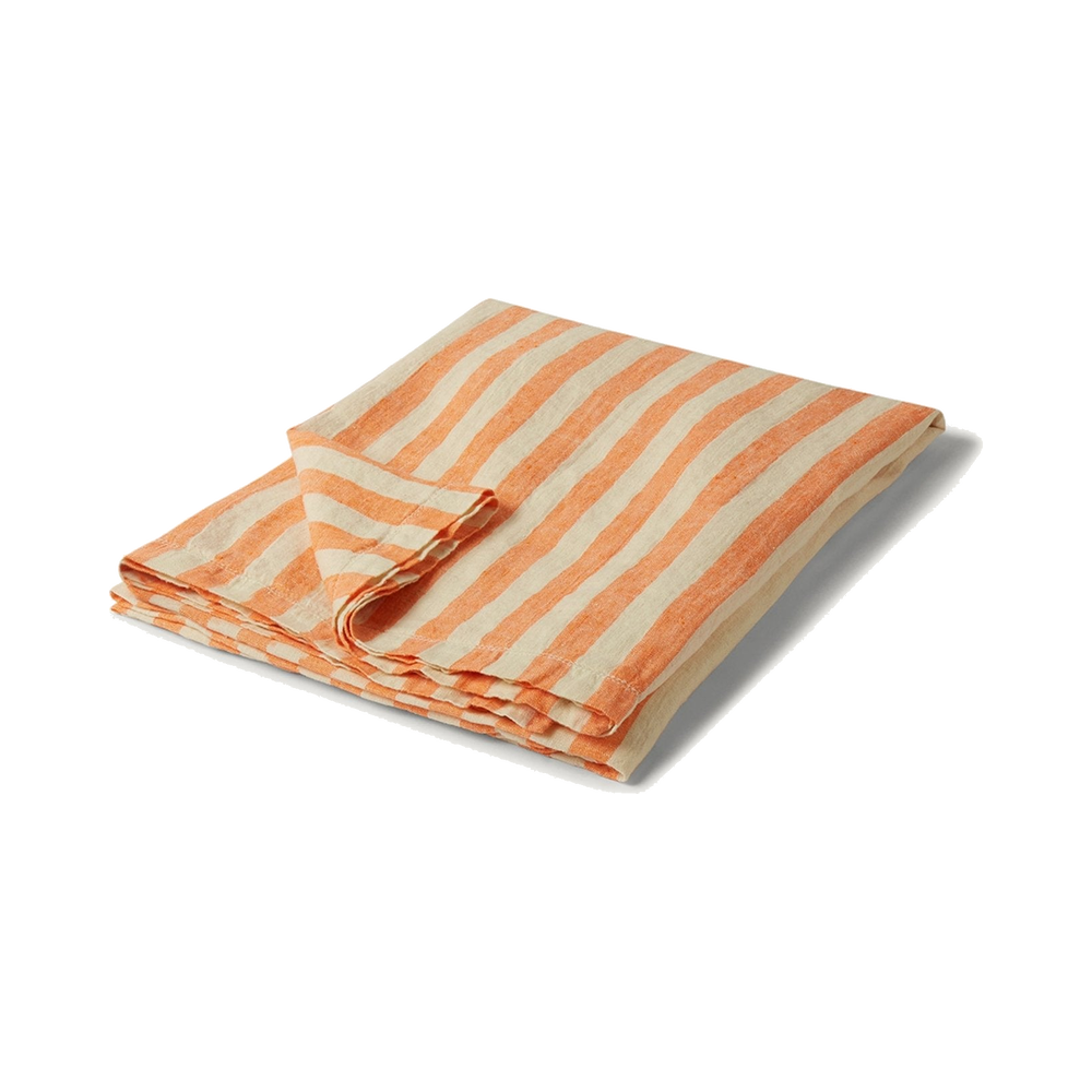 Folded orange-and-off-white Frescobol Carioca linen towel.