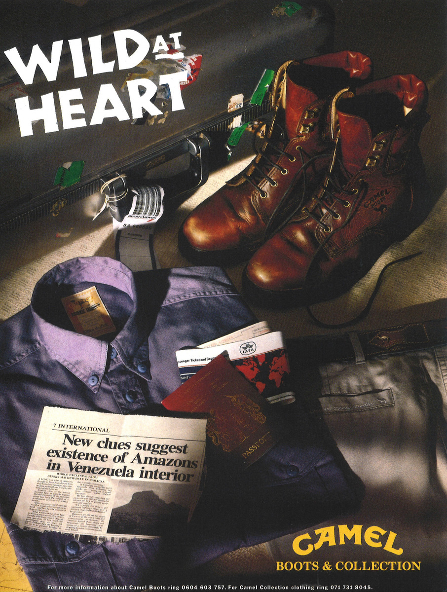 Colour Camel Boots and Collection advertisement showing brown boots, clothing, travel documents and luggage under the words “Wild at Heart”.