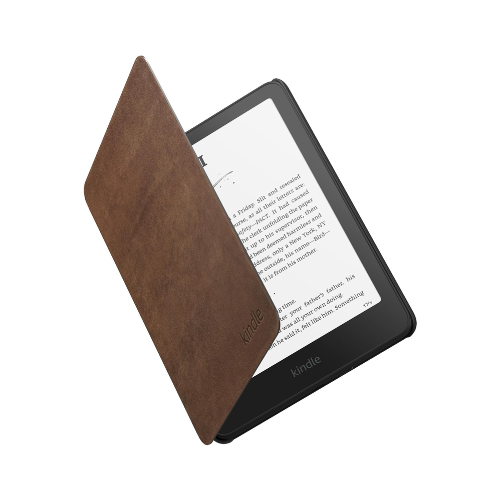 Kindle Paperwhite in an open walnut-brown leather cover.