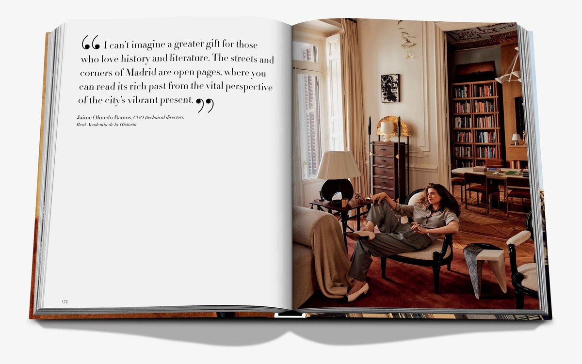 An open spread pairing a quotation with a quiet sitting room lined with books.