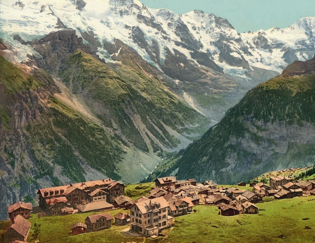 Colour view of Mürren’s hotels and wooden houses beneath the mountains above the Lauterbrunnen valley.