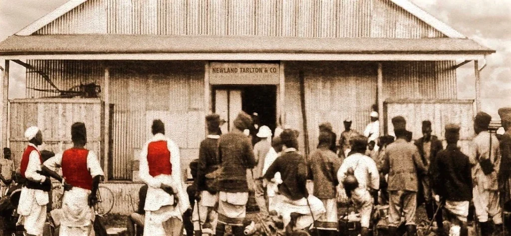 Safari staff outside the corrugated-iron Newland & Tarlton headquarters in Nairobi.