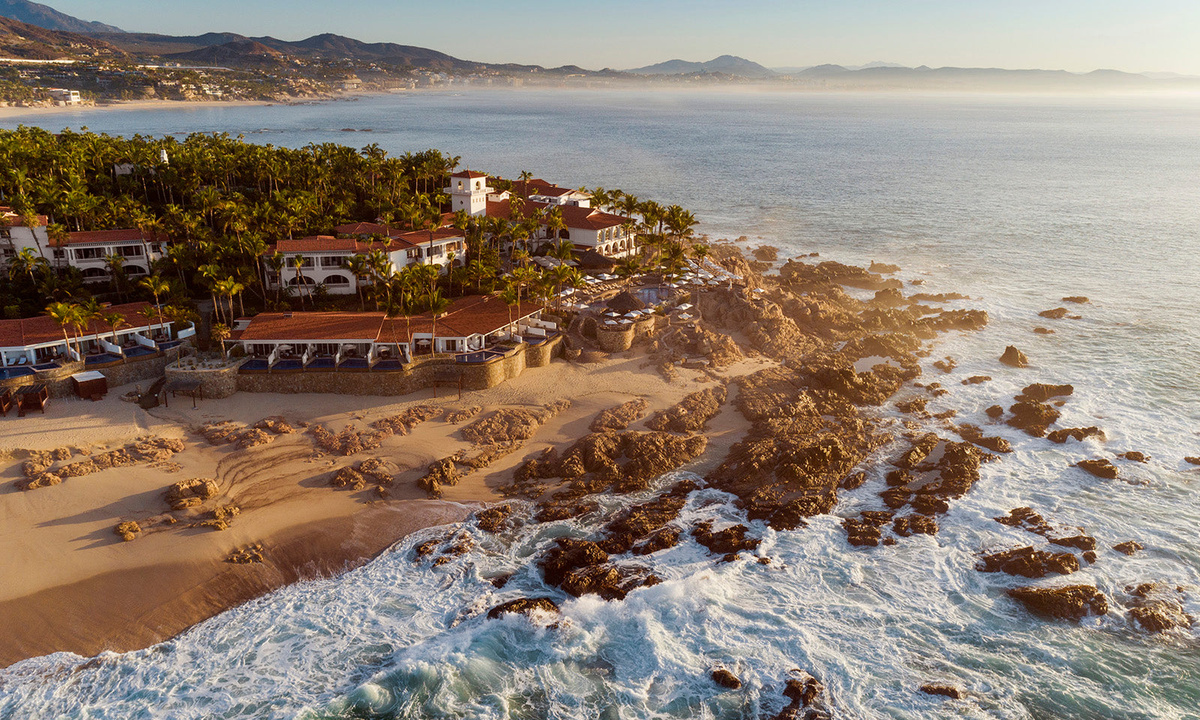 White surf breaking over the rocks below One&Only Palmilla’s oceanfront buildings.