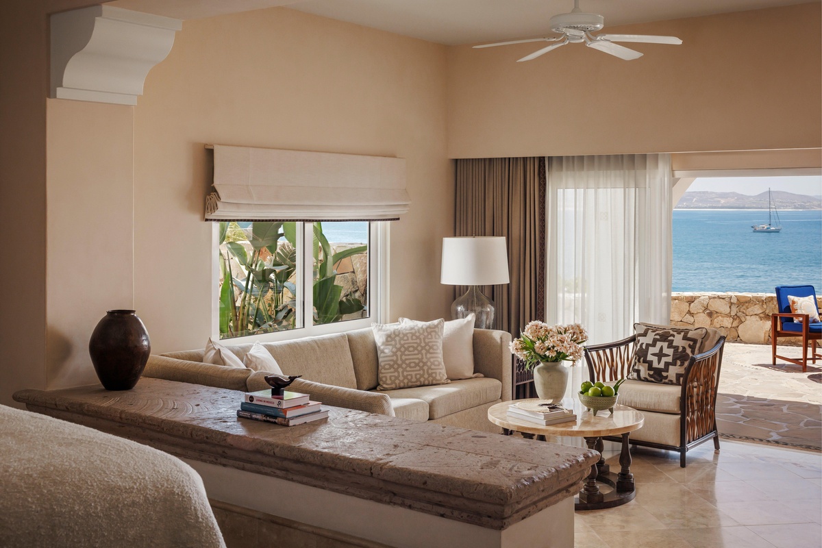 Cream-colored sitting room opening onto a terrace overlooking the Sea of Cortez.