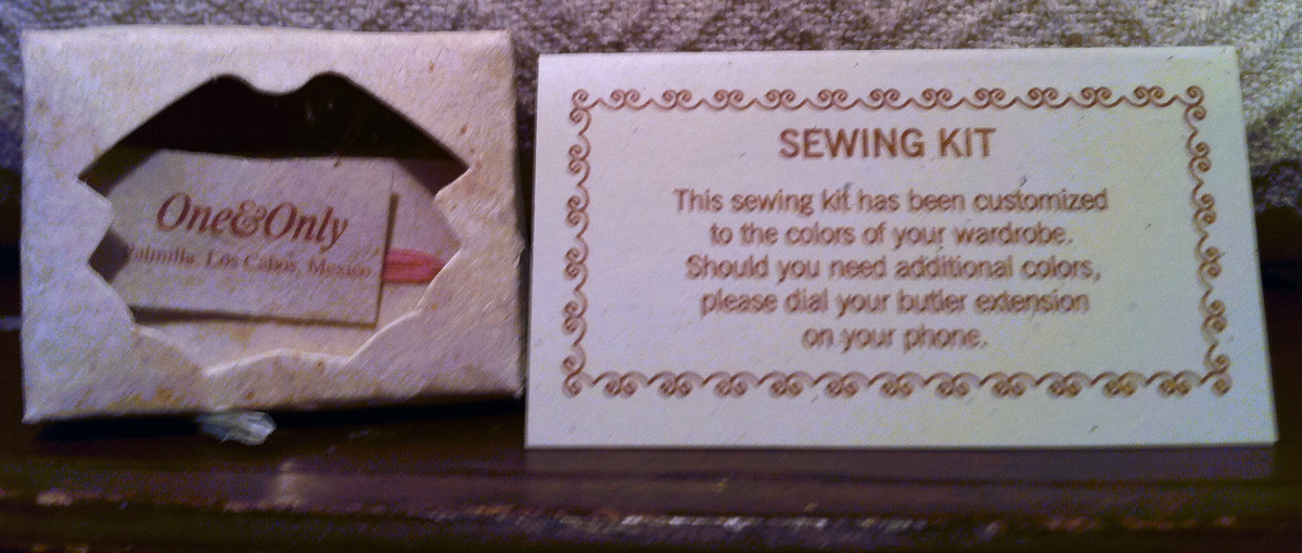 One&Only Palmilla sewing kit beside a card explaining that the threads match the guest’s wardrobe.
