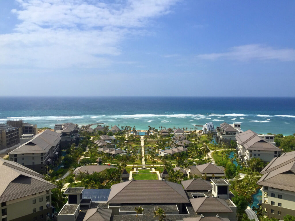 The Ritz-Carlton, Bali, with resort gardens and rooftops extending towards the Indian Ocean
