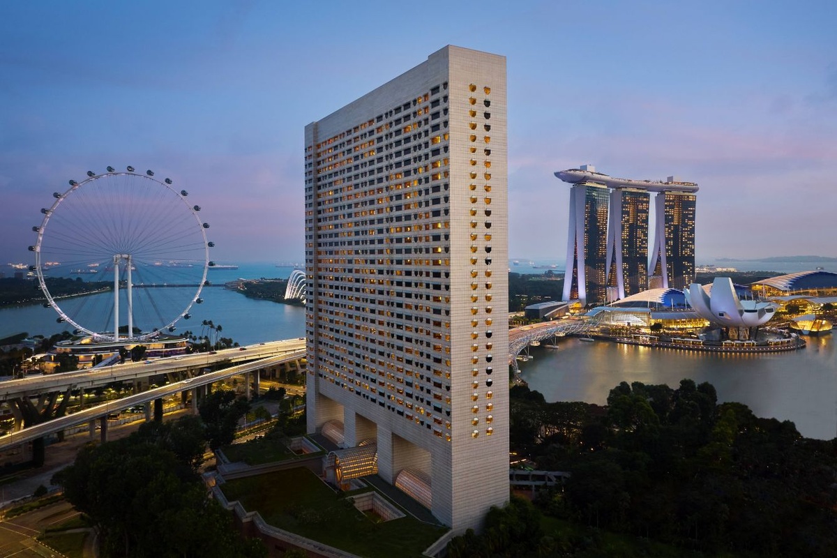 The Ritz-Carlton tower beside the Singapore Flyer with Marina Bay Sands across the bay