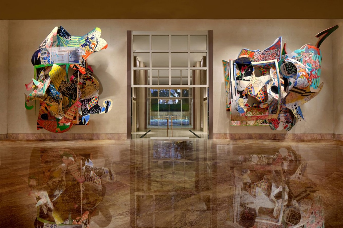 Two colourful sculptural works in the marble-floored Stella Gallery