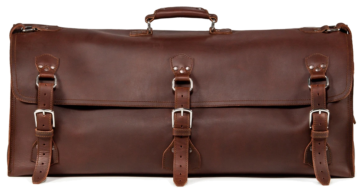 Dark brown Saddleback Beast duffle with a top handle and three buckled straps.