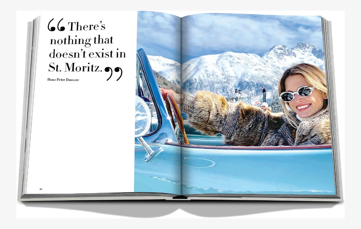 An open spread with snowy Alpine peaks and a woman wearing sunglasses in a pale blue car.
